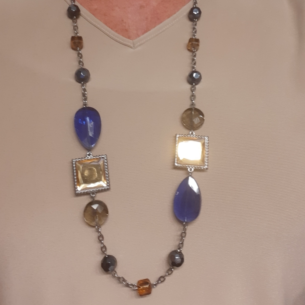 Blues, golds. Very pretty long necklace